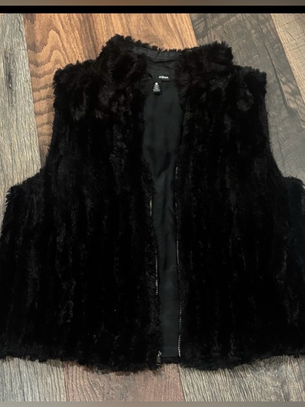 Aqua Bloomingdales  Black
Faux Fur Vest size small. Zip up with pockets
